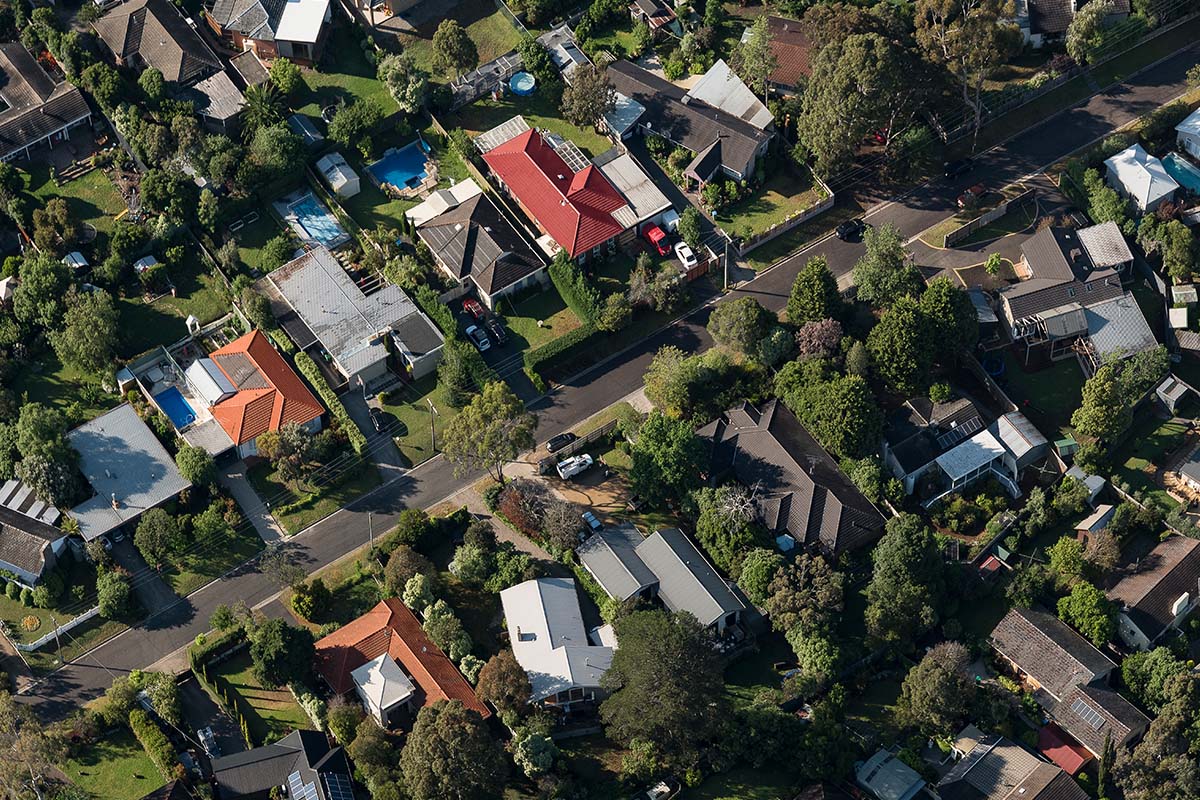 Description: Photo of a vacant residential block with temporary fence erected at the footpath. AS Planning are Town Planners in Victoria.