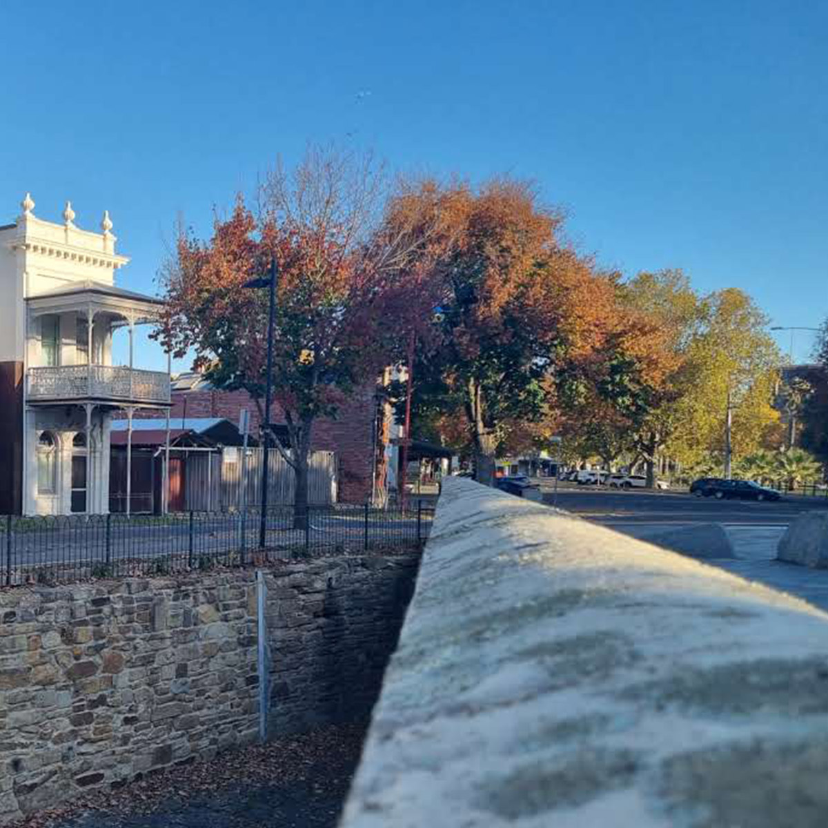 Description: Photo of a vacant residential block with temporary fence erected at the footpath. AS Planning are Town Planners in Victoria.