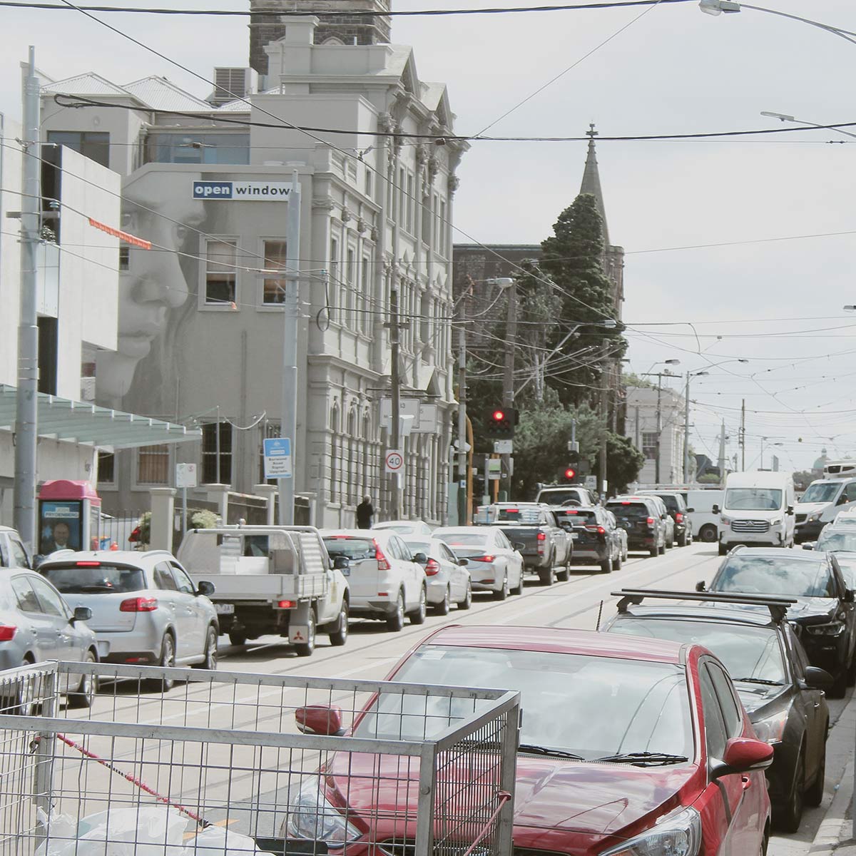 Description: Photo of a vacant residential block with temporary fence erected at the footpath. AS Planning are Town Planners in Victoria.