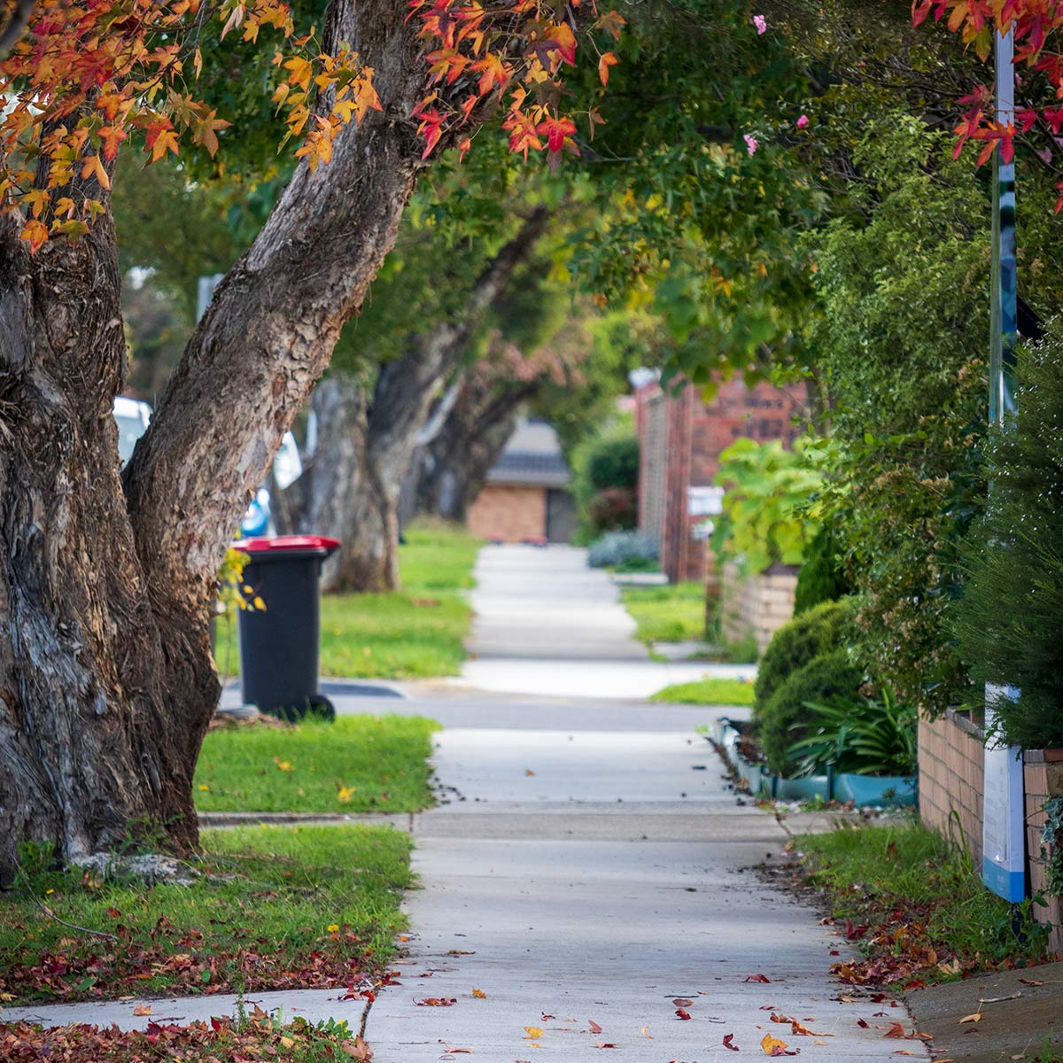 Description: Photo of a vacant residential block with temporary fence erected at the footpath. AS Planning are Town Planners in Victoria.