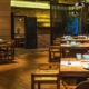 Essential Permits & Approvals for opening a new or franchised Restaurant, Cafe or other hospitality business - Picture of the interior of a restaurant with tables and seats, and plates and cutlery laid out on tables.