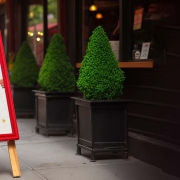 Image of front of restaurant with aframe sign on footpath